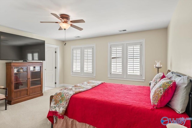 bedroom featuring visible vents, carpet floors, baseboards, and ceiling fan