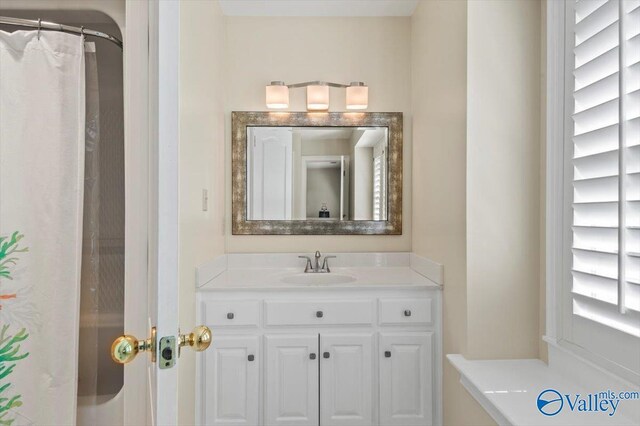 bathroom featuring tile patterned flooring and vanity