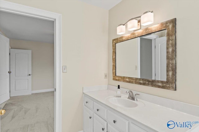 bathroom with baseboards and vanity