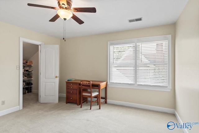 office area featuring baseboards, visible vents, and light carpet