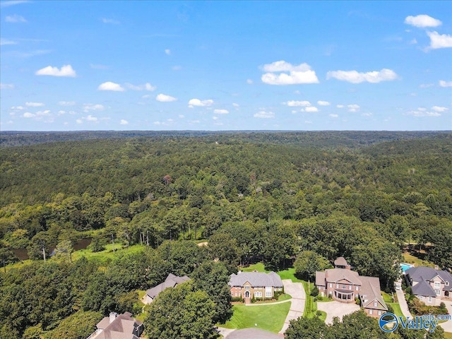 bird's eye view featuring a wooded view
