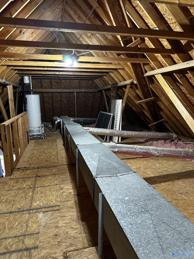 unfinished attic with gas water heater