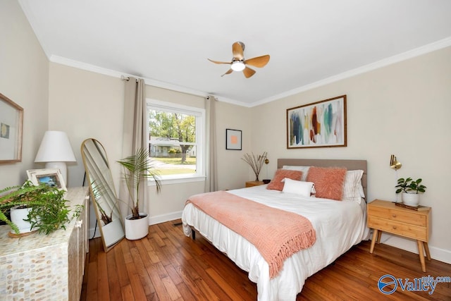 bedroom with hardwood / wood-style floors, baseboards, and ornamental molding