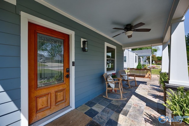 doorway to property with a ceiling fan and covered porch