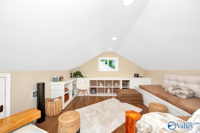 living area featuring recessed lighting, wood finished floors, visible vents, and lofted ceiling