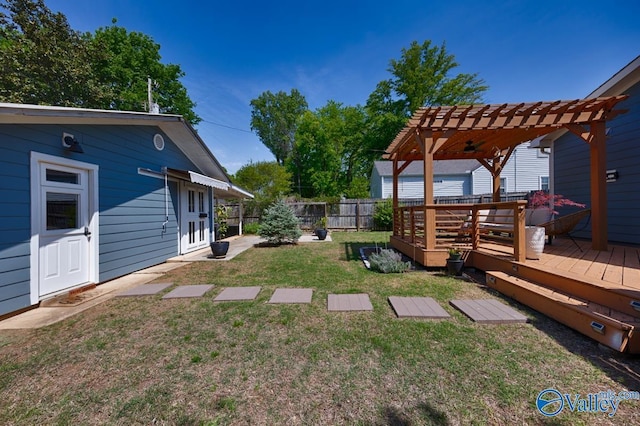 view of yard featuring fence, a pergola, and a wooden deck