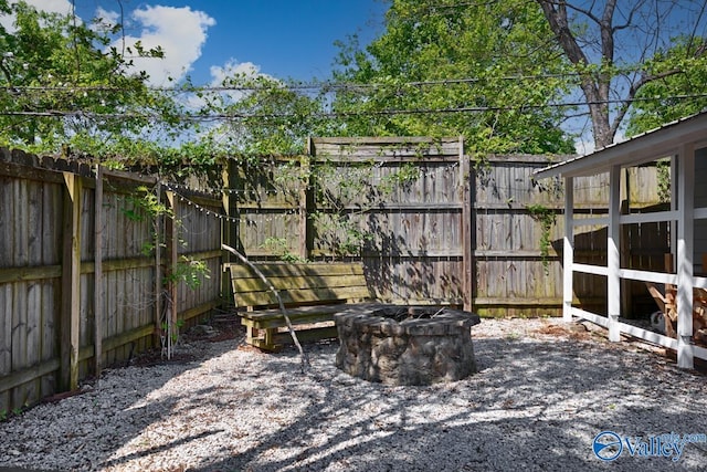 view of patio / terrace featuring a fenced backyard and a fire pit