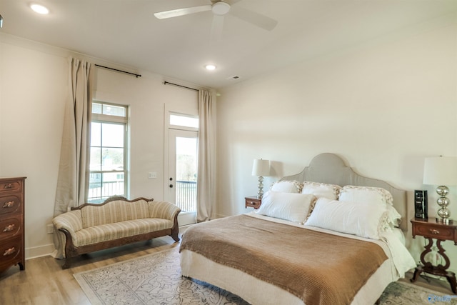 bedroom featuring ceiling fan, light wood-type flooring, and access to exterior