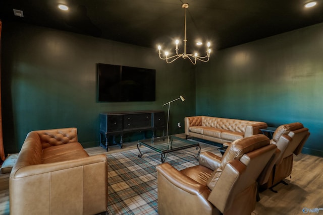 living room featuring a notable chandelier and wood-type flooring