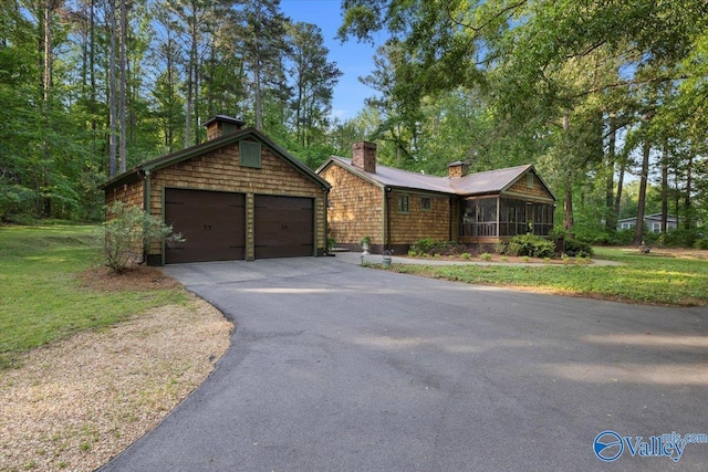 10161 US Highway 11, Springville, AL 35146 - ranch-style home with a chimney, a garage, a front yard, and a sunroom