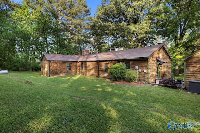 10161 US Highway 11, Springville, AL 35146 - rear view of house featuring a chimney and a lawn