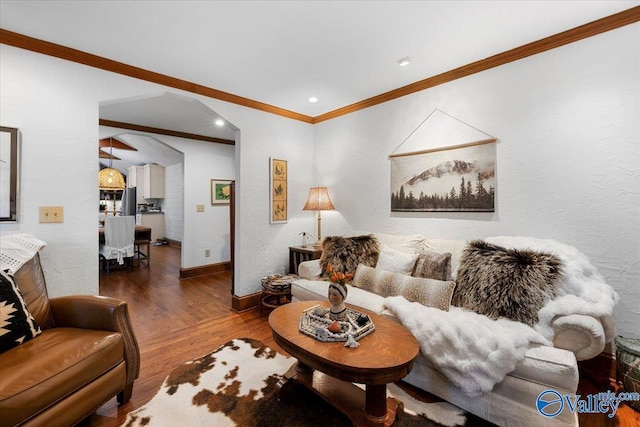 10161 US Highway 11, Springville, AL 35146 - living room with wood finished floors, crown molding, baseboards, arched walkways, and recessed lighting