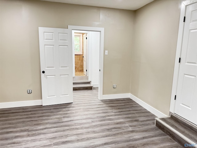 403 SW Arcadia St, Hartselle, AL 35640 - empty room with wood finished floors and baseboards