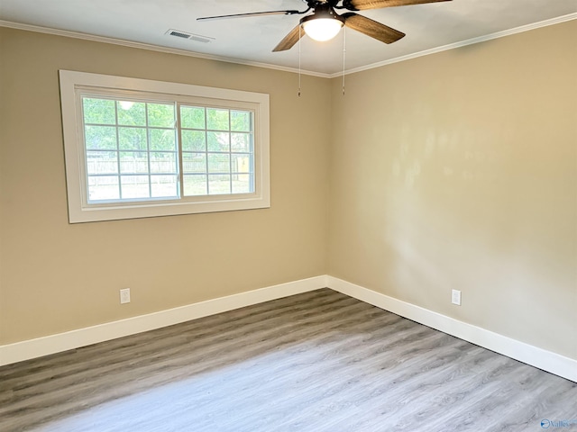 403 SW Arcadia St, Hartselle, AL 35640 - unfurnished room with a ceiling fan, baseboards, wood finished floors, and crown molding