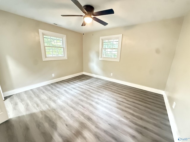 403 SW Arcadia St, Hartselle, AL 35640 - unfurnished room with healthy amount of natural light, baseboards, and ceiling fan