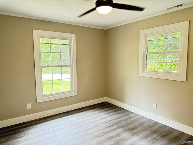 403 SW Arcadia St, Hartselle, AL 35640 - empty room featuring healthy amount of natural light, ornamental molding, and baseboards