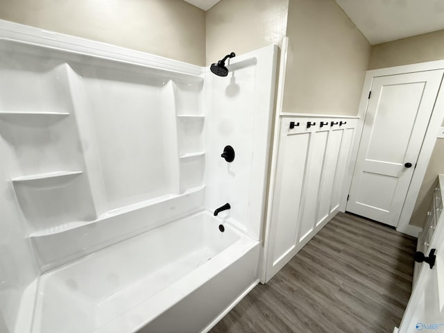 403 SW Arcadia St, Hartselle, AL 35640 - bathroom featuring wood finished floors and bathtub / shower combination