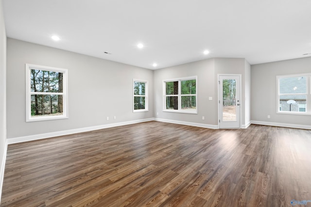 unfurnished living room featuring dark hardwood / wood-style flooring