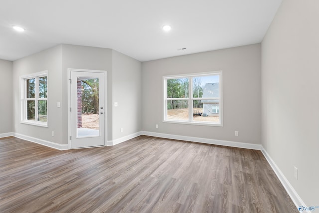 unfurnished living room with light wood-type flooring