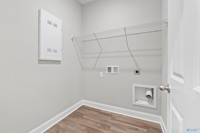 washroom featuring hookup for a washing machine, electric dryer hookup, and hardwood / wood-style floors