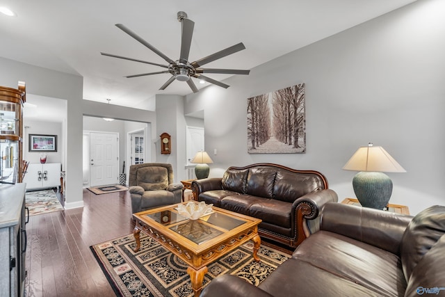 living room featuring dark hardwood / wood-style floors and ceiling fan