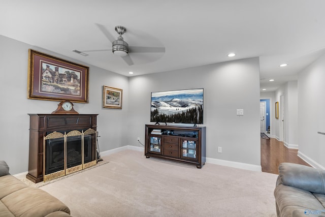 living room with carpet and ceiling fan