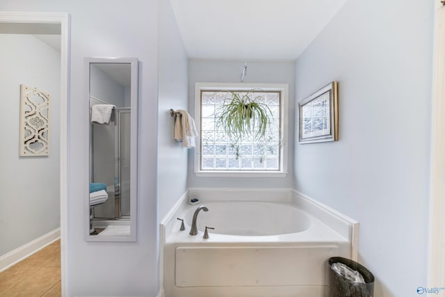 bathroom featuring tile patterned floors and independent shower and bath