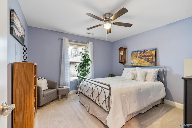 bedroom with light colored carpet and ceiling fan