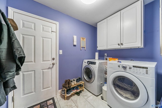 laundry room with cabinets and washing machine and dryer