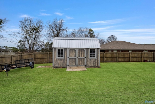 view of outdoor structure featuring a lawn