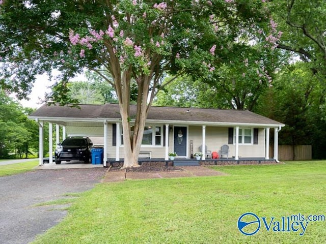 152 6th St W, Grant, AL 35747 - ranch-style home featuring asphalt driveway, a porch, and a carport