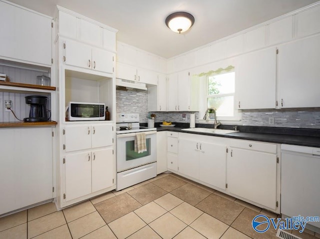 152 6th St W, Grant, AL 35747 - kitchen with white appliances, a sink, under cabinet range hood, tasteful backsplash, and white cabinetry