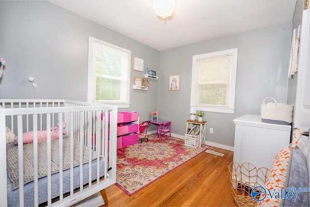 152 6th St W, Grant, AL 35747 - bedroom featuring wood finished floors and baseboards