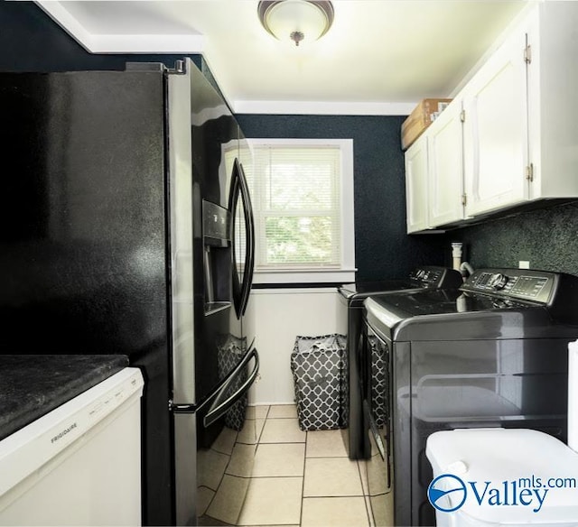 152 6th St W, Grant, AL 35747 - laundry area featuring independent washer and dryer, cabinet space, and light tile patterned floors