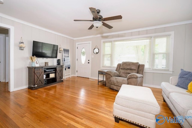 152 6th St W, Grant, AL 35747 - living room featuring crown molding, light wood-style flooring, a ceiling fan, and baseboards
