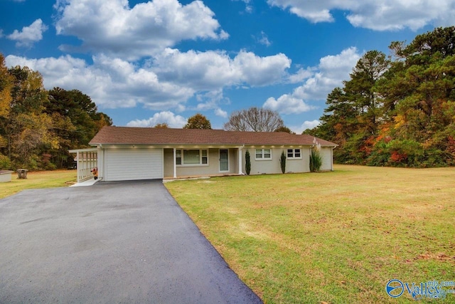 single story home with aphalt driveway and a front yard