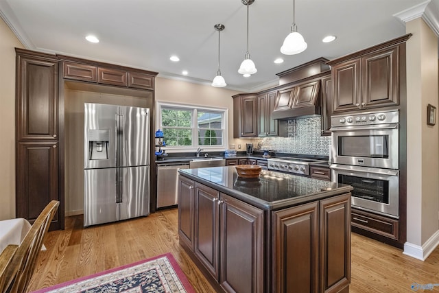902 County Road 163, Centre, AL 35960 - kitchen featuring appliances with stainless steel finishes, dark brown cabinetry, ornamental molding, decorative backsplash, and hanging light fixtures