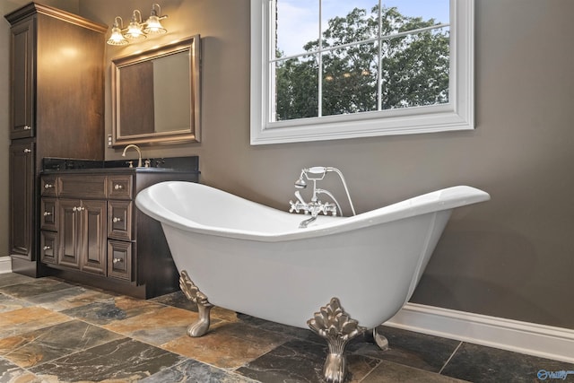902 County Road 163, Centre, AL 35960 - full bathroom with a freestanding tub, stone finish flooring, and vanity