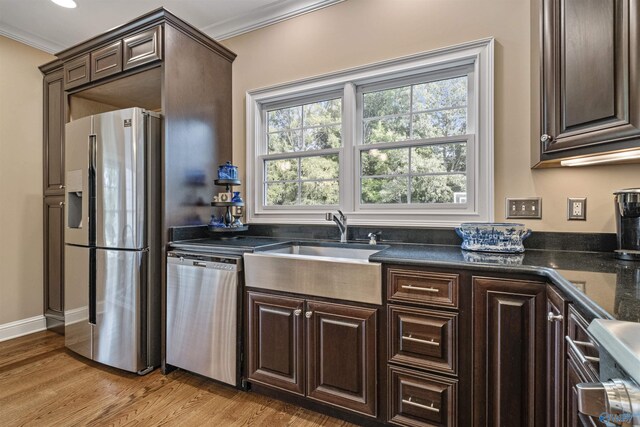 902 County Road 163, Centre, AL 35960 - kitchen featuring appliances with stainless steel finishes, crown molding, dark brown cabinets, and light wood finished floors