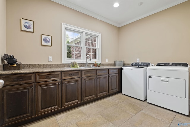 902 County Road 163, Centre, AL 35960 - laundry room featuring washer and clothes dryer, crown molding, and cabinet space