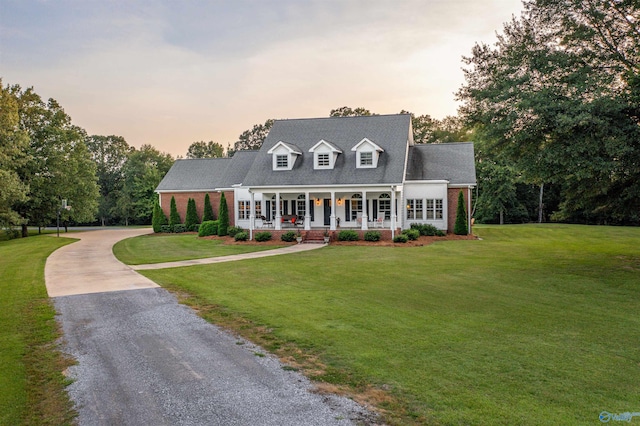 902 County Road 163, Centre, AL 35960 - new england style home featuring driveway, a porch, a lawn, and brick siding
