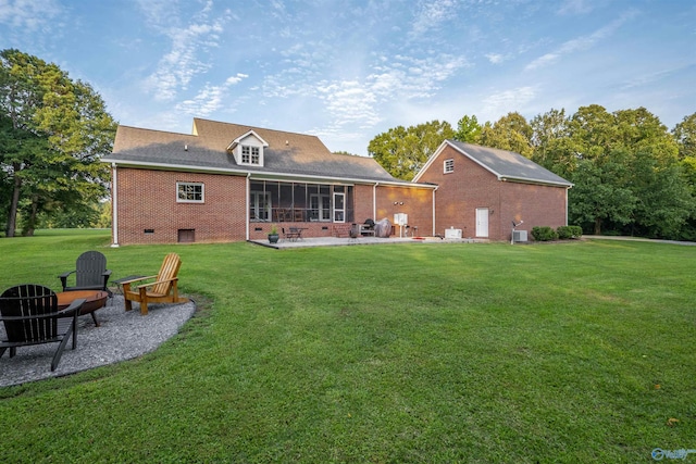 902 County Road 163, Centre, AL 35960 - rear view of house with a patio, brick siding, a yard, a sunroom, and an outdoor fire pit