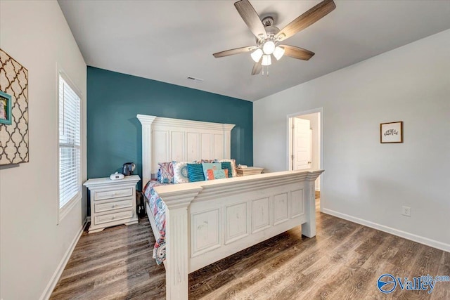 bedroom featuring ceiling fan and dark hardwood / wood-style flooring