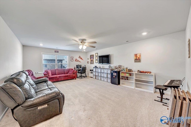 living room with ceiling fan and light carpet