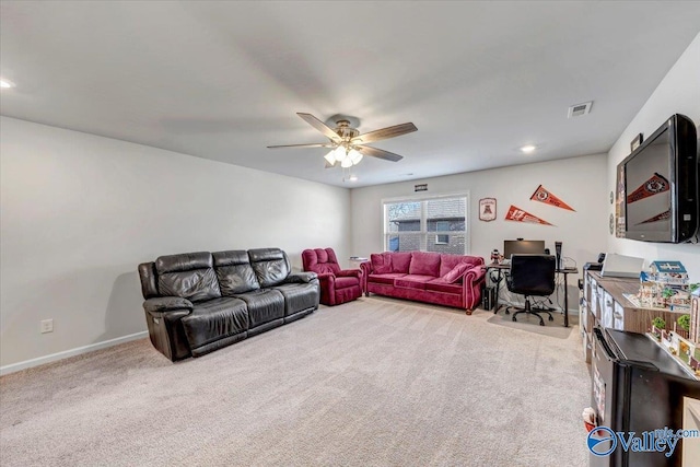 carpeted living room featuring ceiling fan