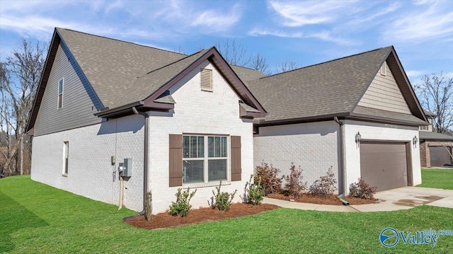 exterior space with a garage and a yard