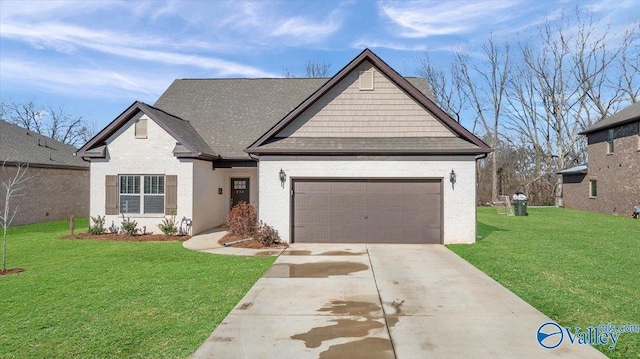 view of front of property with a front lawn and a garage