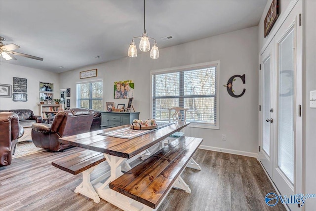 dining area featuring ceiling fan and dark hardwood / wood-style floors