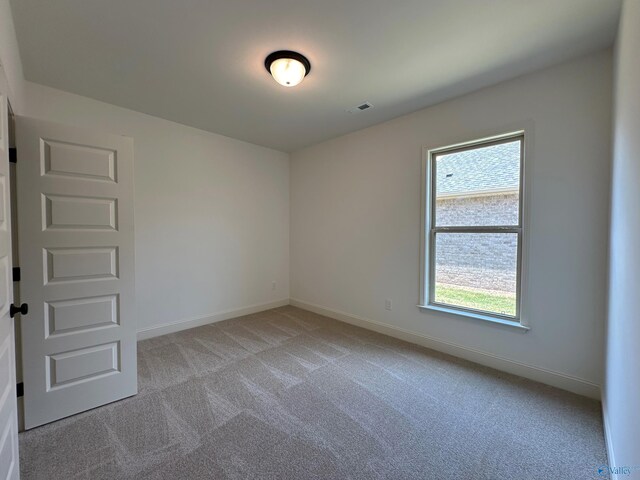 view of carpeted spare room