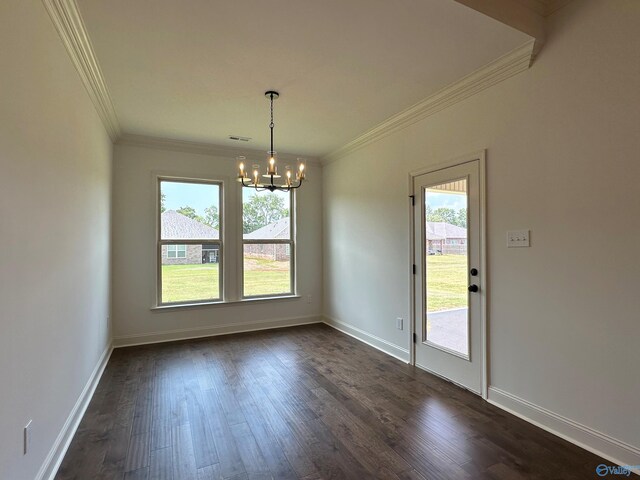 interior space featuring ornamental molding, dark hardwood / wood-style flooring, an inviting chandelier, and plenty of natural light